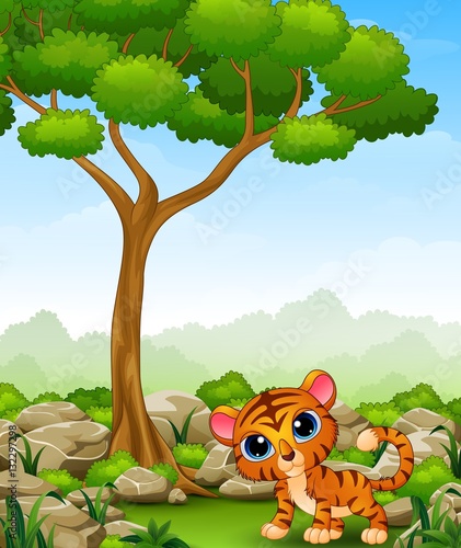 Fototapeta Naklejka Na Ścianę i Meble -  Cartoon baby tiger in the jungle