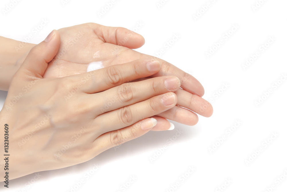 Apply small amount of body lotion to moisture the palm skin on white background isolated