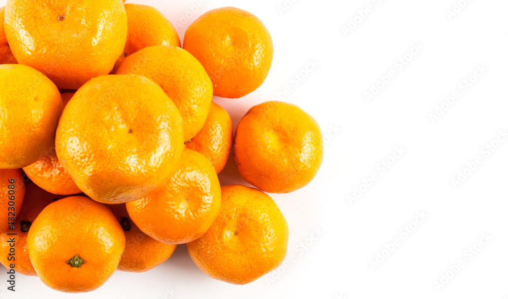 Ripe mandarines close-up on a white background. Ripe mandarines close-up on a white background.