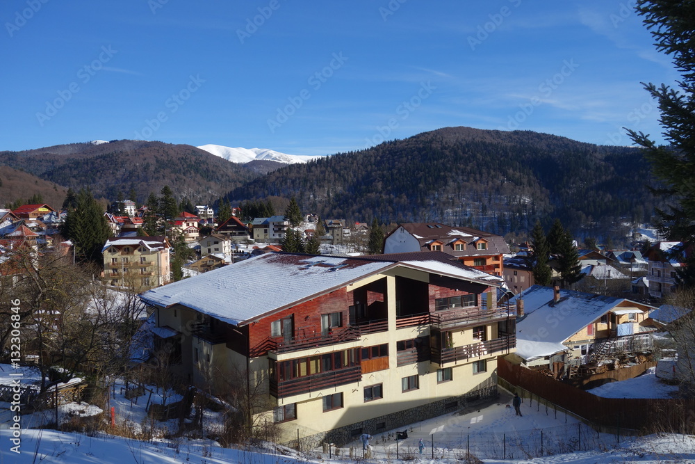 Broad view over Busteni mountain resort in Romania in winter