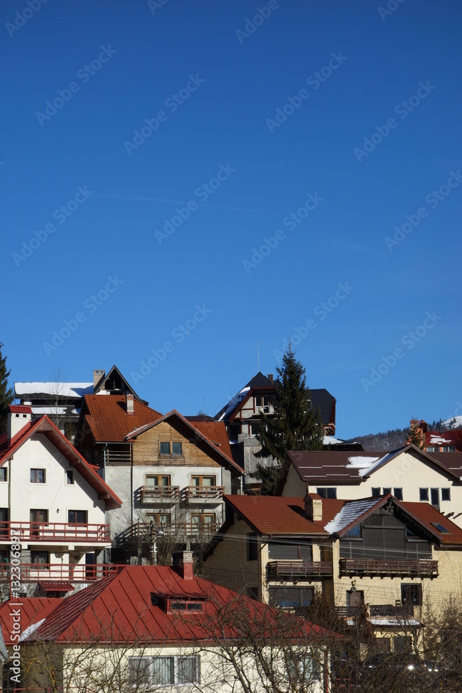Mountain pensions facades in Busteni mountain resort in Romania