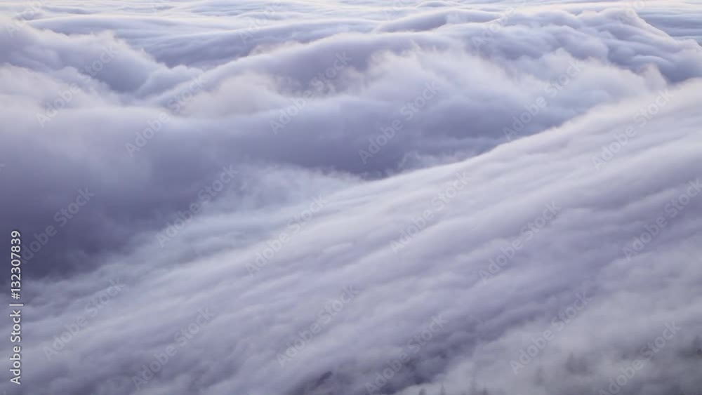 Heavy clouds flowing above mountain forest Heavy clouds flowing above mountain forest
