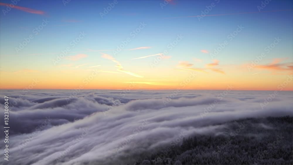 Beautiful sunrise above clouds in time lapse Beautiful sunrise above clouds in time lapse