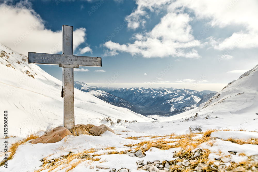 Memorial cross in the mountains in the National Nature Reserve in Adygea, Russia. Memorial cross in the mountains in the National Nature Reserve in Adygea, Russia.