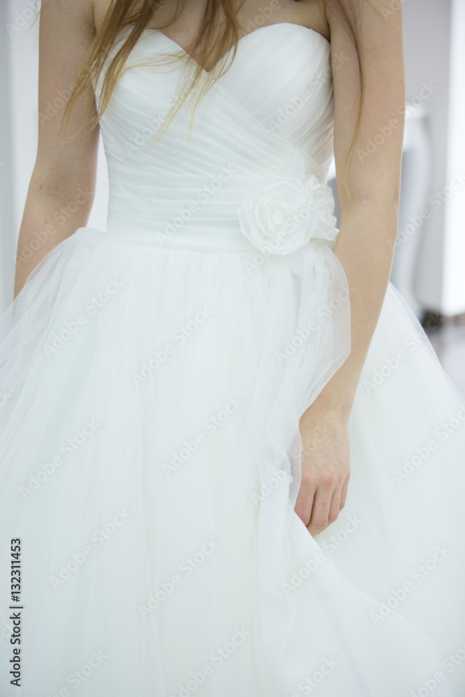Bride white wedding dress, shallow focus, tulle cloth, vertical Bride white wedding dress, shallow focus, tulle cloth, vertical