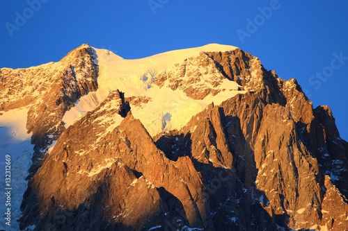 Alpine peak Grandes Jorasses at sunset light photo