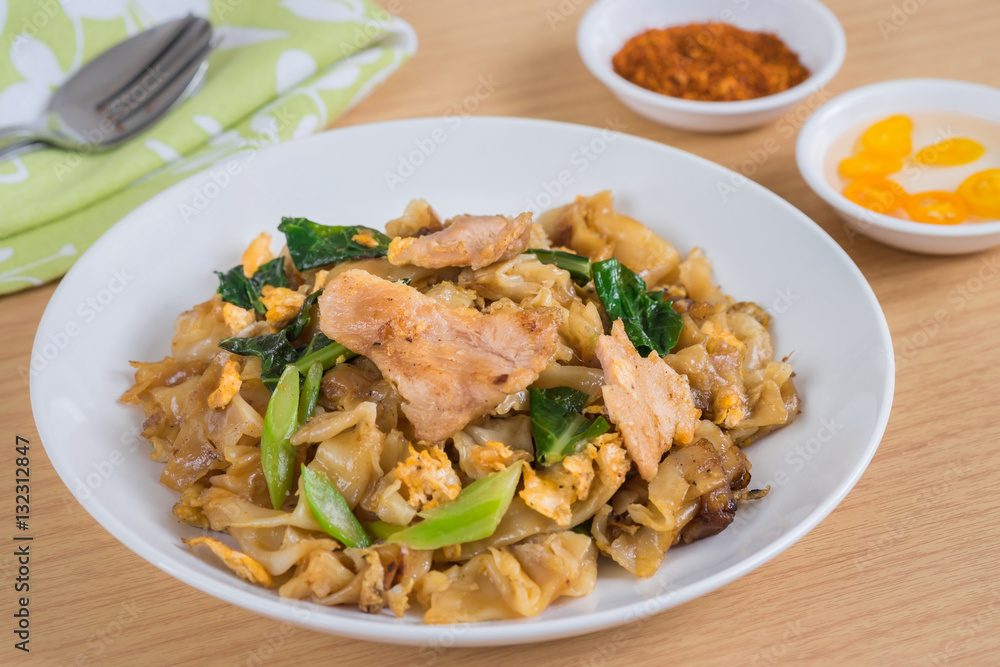 Stir fried rice noodle with pork on plate Stir fried rice noodle with pork on plate