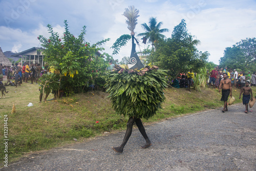 Traditional masked man at a Taboo death ceremony, East New Britain, Papua New Guinea
