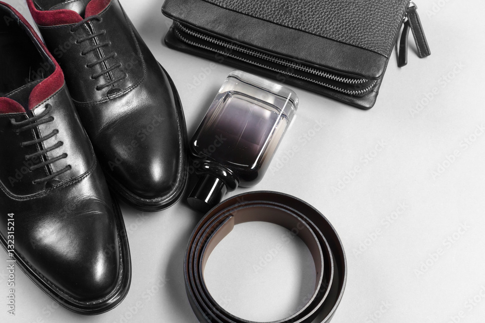 shoes and accessories for men lay on the wooden floor shoes and accessories for men lay on the wooden floor