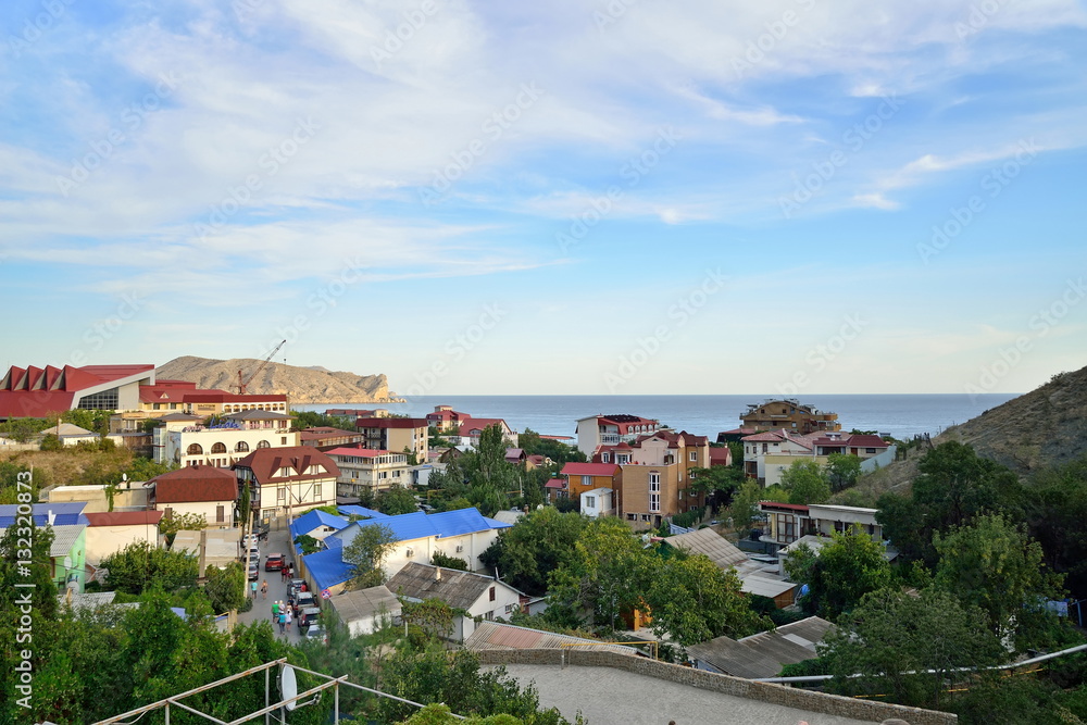 The panorama of the evening city Sudak. Sudak. Crimea