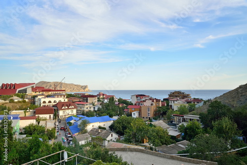 The panorama of the evening city Sudak. Sudak. Crimea © herculerus