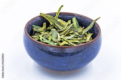 Longjing (Dragon Well) - Chinese green tea isolated on white. photo