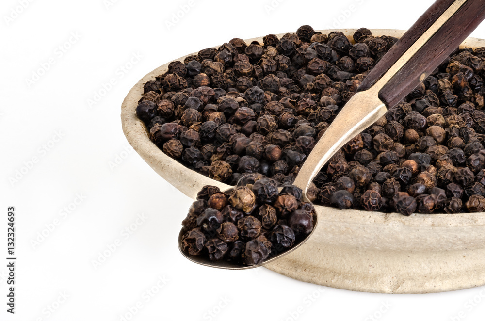 Whole Black Pepper in Old stone bowl Whole Black Pepper in Old stone bowl