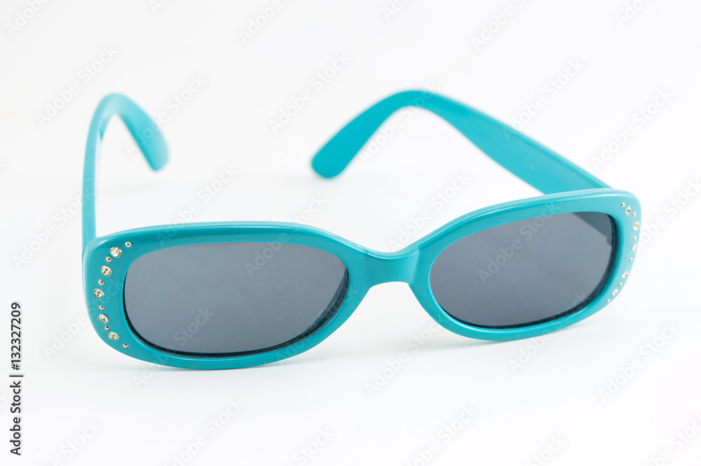 Blue children sunglasses on white background Blue children sunglasses on white background