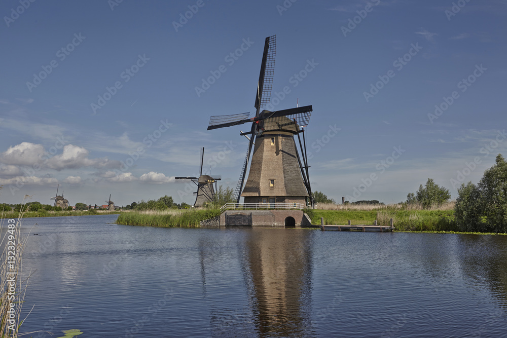 Several dutch stone brick windmills at Kinderdijk, an UNESCO wor