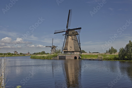 Several dutch stone brick windmills at Kinderdijk, an UNESCO wor