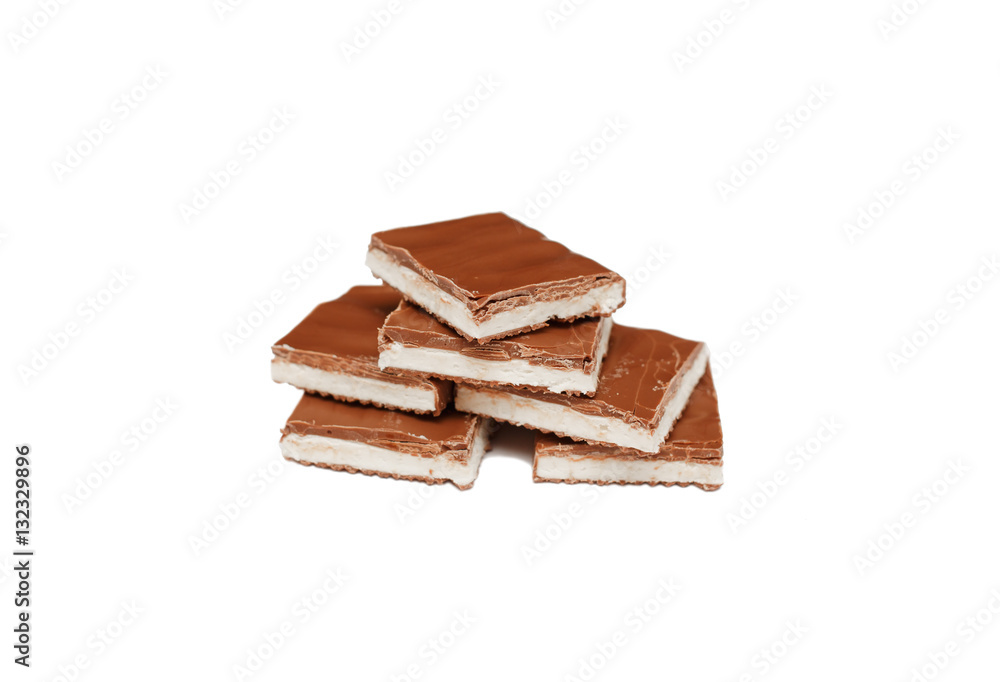 Pieces of milk chocolate with nougat. Vanilla ice cream with milk chocolate. Sweetness. Dessert. Pieces of milk chocolate with nougat. Vanilla ice cream with milk chocolate. Sweetness. Dessert.