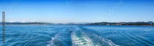 View of the San Juan Islands and Washington coast from the stern of a Washington State Ferry leaving Anacortes photo