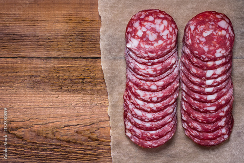 Quadro em tela Sausage cut into circles on the paper