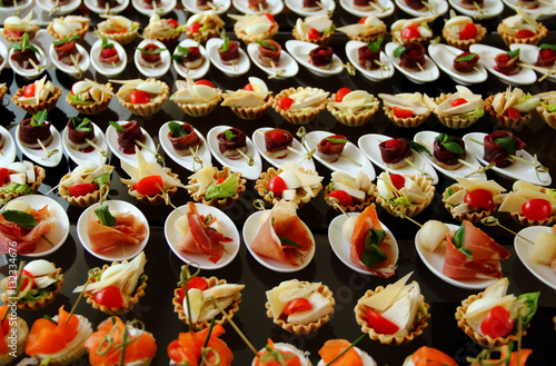 Savoury Canapes with Ham and Red Fish Closeup Ctock Photo 