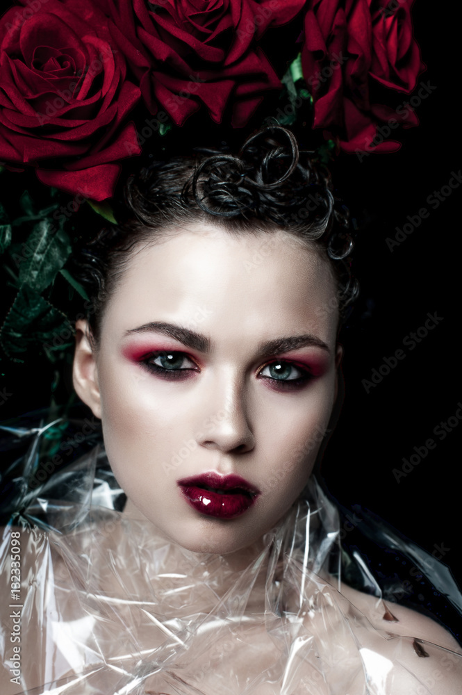 Beauty Fashion Model Woman face. Portrait with Red Rose flowers. Red Lips and Nails. Beautiful Brunette Woman with Luxury Makeup, perfect skin. Valentine. Beauty Fashion Model Woman face. Portrait with Red Rose flowers. Red Lips and Nails. Beautiful Brunette Woman with Luxury Makeup, perfect skin. Valentine.