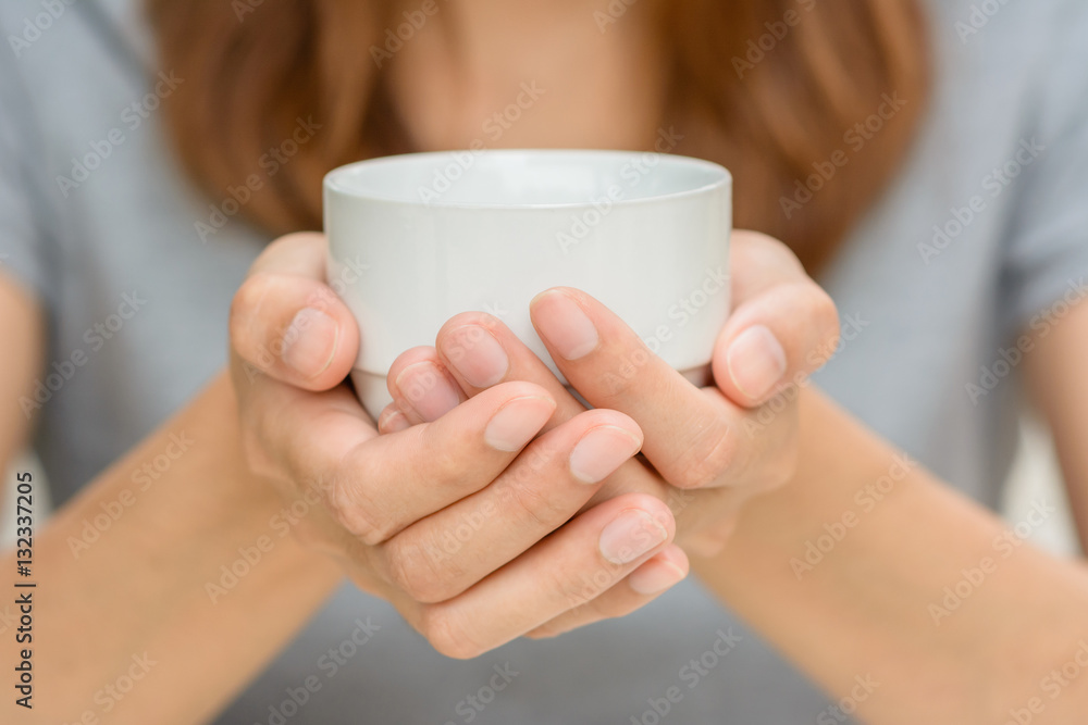 Woman hands holding coffee cup. Woman hands holding coffee cup.