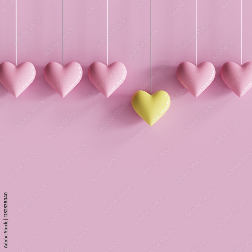 hanging outstanding yellow heart different pink hearts on pink background. minimal concept.