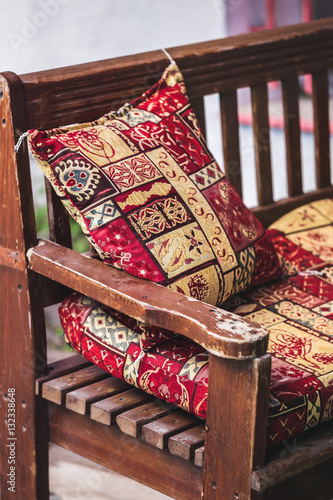 Traditional oriental decoration cafe, colorful pillows with hand