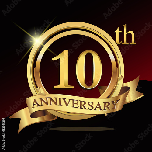 Fototapeta 10 years golden anniversary logo celebration with ring and ribbon
