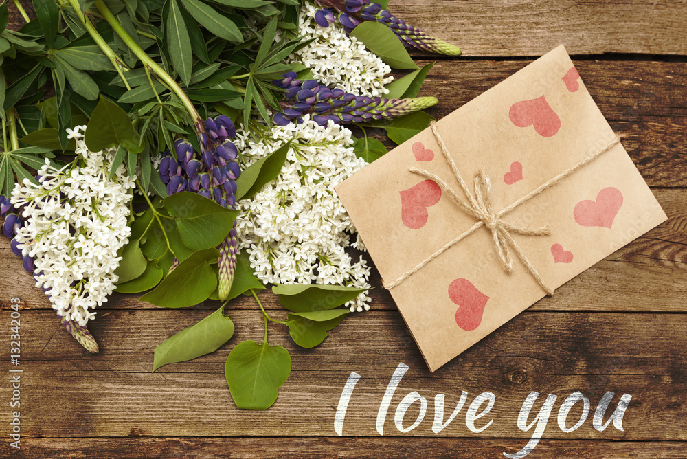 Lilac branch on wooden background, Valentine's Day and Mothers Lilac branch on wooden background, Valentine's Day and Mothers