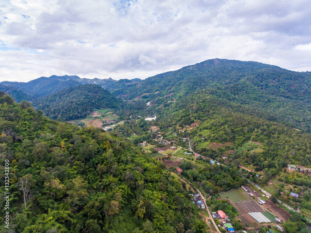 Aerial View of Small Village among Mountains.