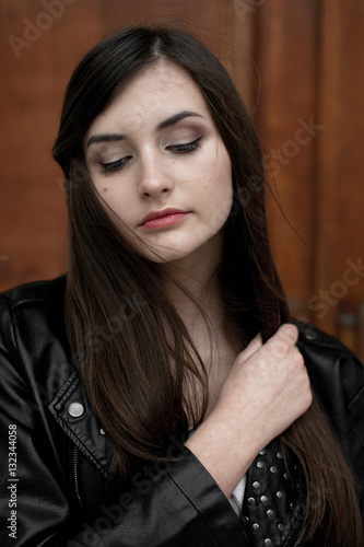 Young elegant trendy lady outdoors, wearing black and white clothing © dashamuller