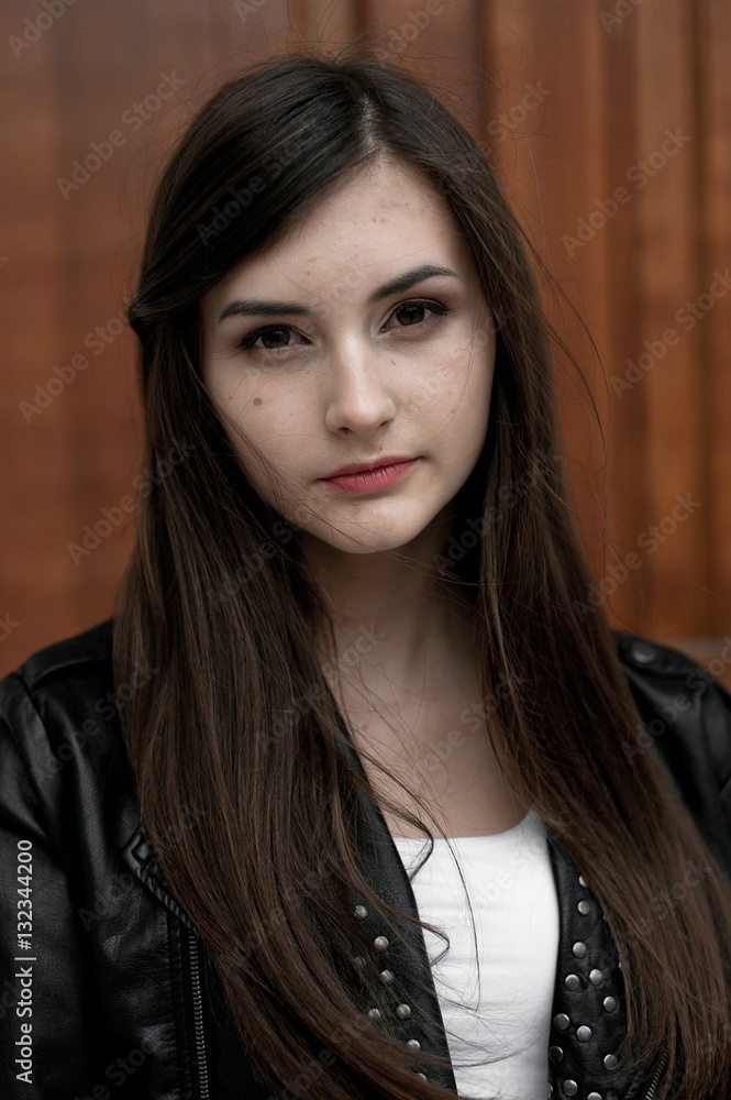Young elegant trendy lady outdoors, wearing black and white clothing Young elegant trendy lady outdoors, wearing black and white clothing