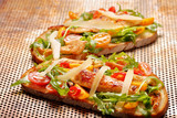 Chicken sandwich on fresh bread with arugula