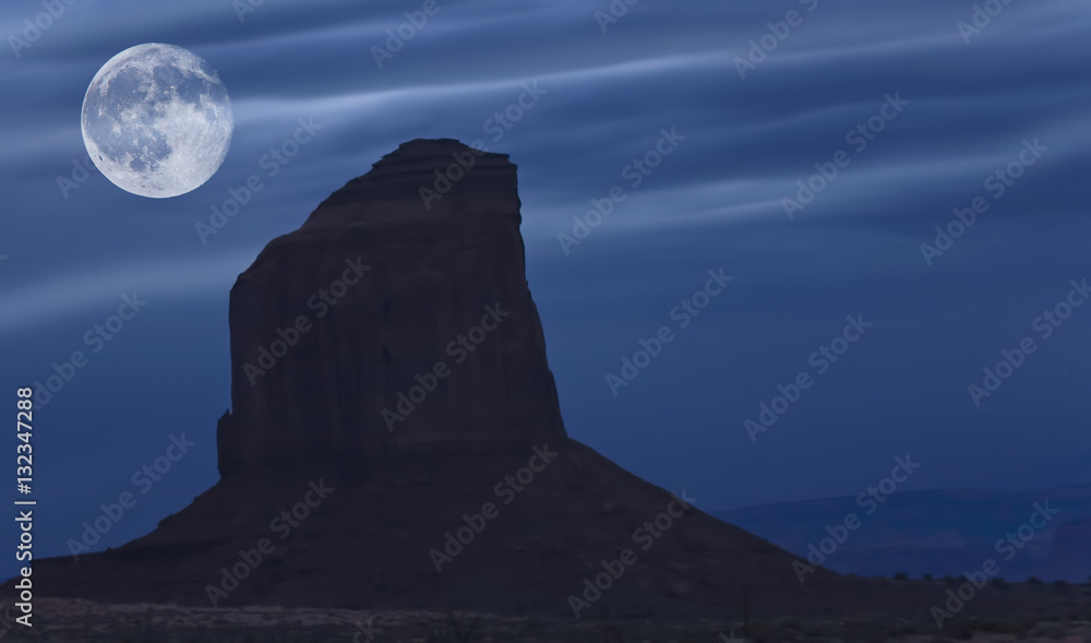 Risng moon over Monument Valley