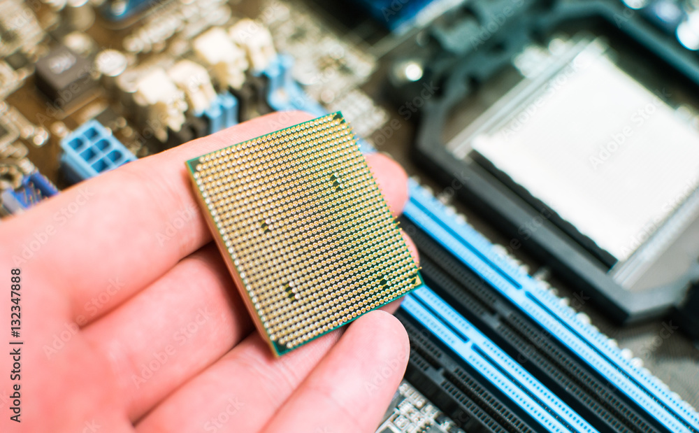 Installing the CPU into the motherboard Stock Photo | Adobe Stock