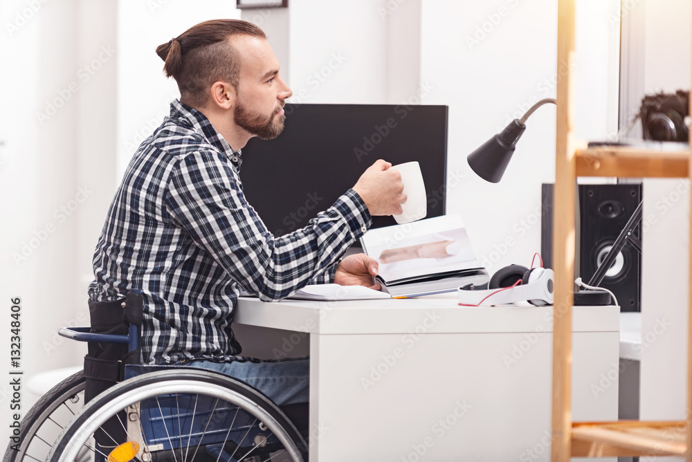 Thoughtful young man sitting at the table Thoughtful young man sitting at the table
