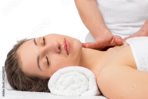 serene girl on procedure of massage, face and neck