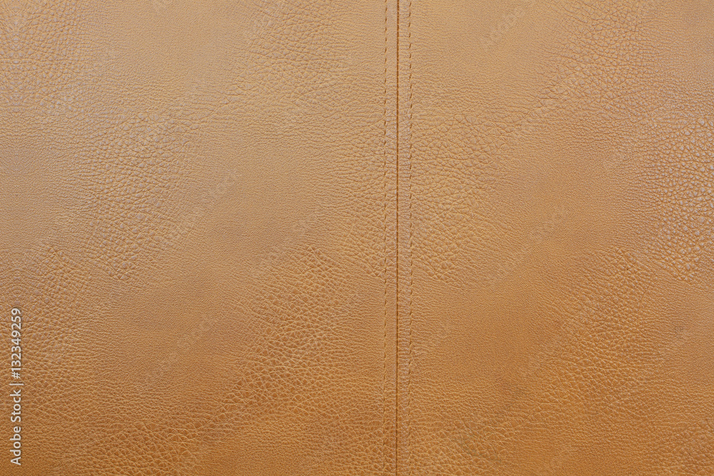 Fototapeta premium Empty gold brown animal skins with sewing line for Tailor crafting business, leather at textile factory 