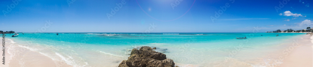 Panoramic Caribbean beach with white sand and turquoise sea