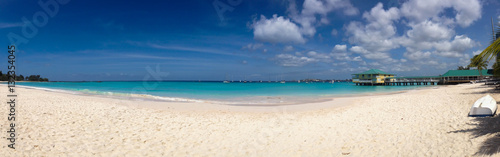Panoramic tropical beach with white sand and turquoise sea