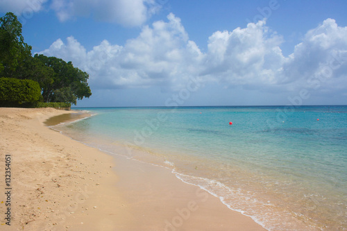 Tropical beach with clear sea and yellow sand