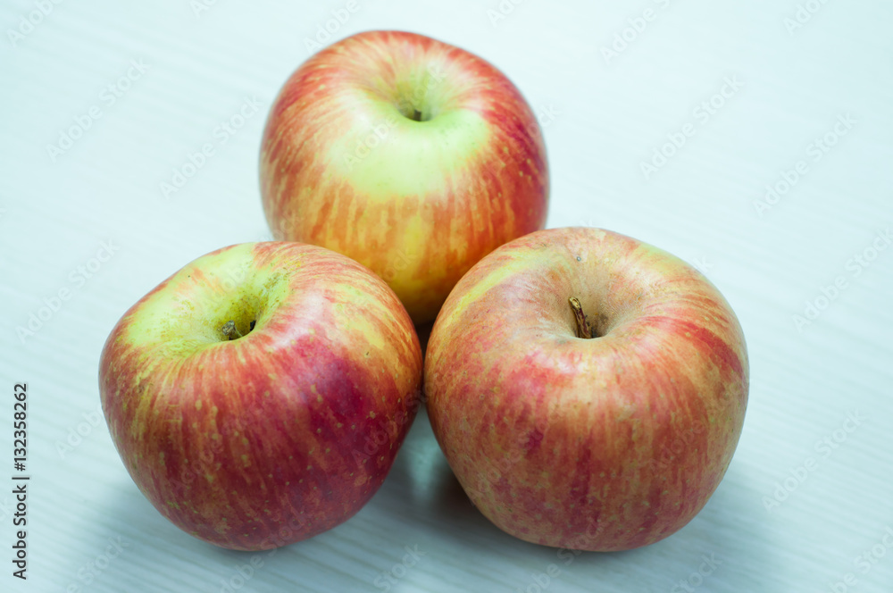 Apple on a wooden white. apple isolated. Apple on a wooden white. apple isolated.