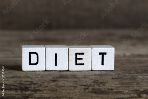 Diet, written in cubes on wooden background