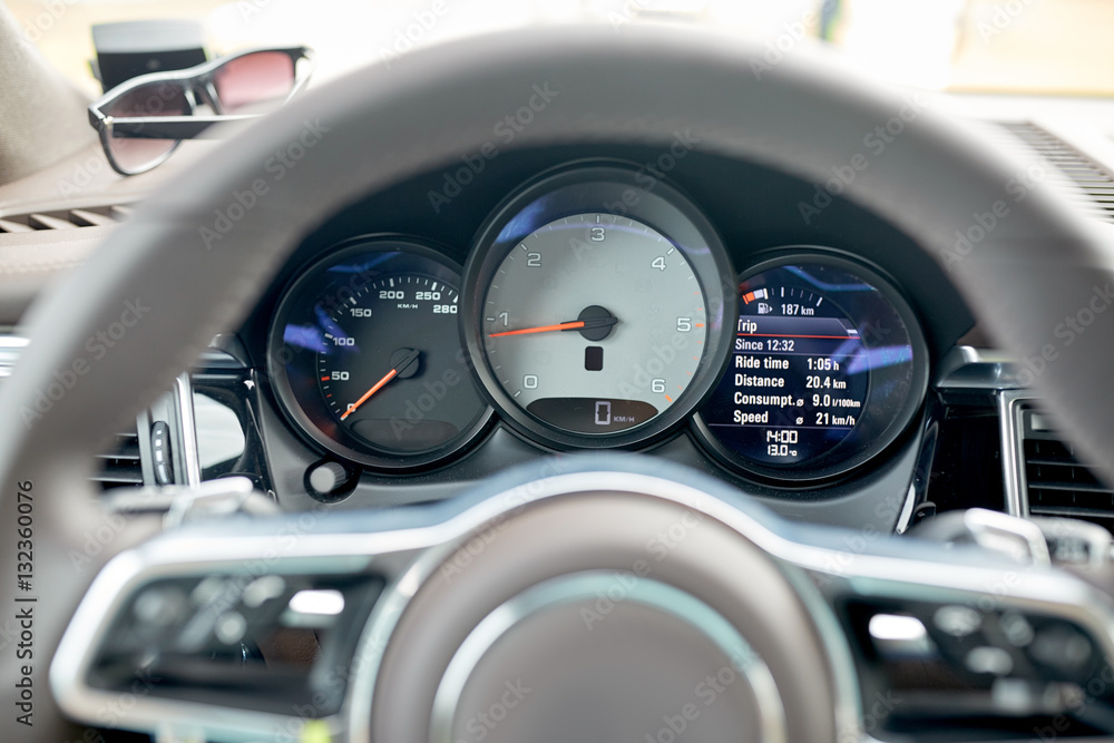 close up of car dashboard and steering wheel