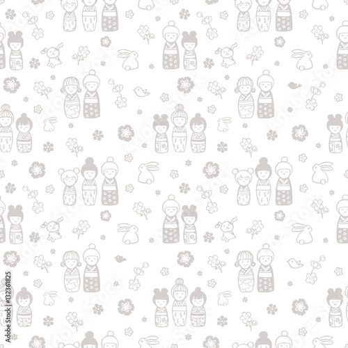 seamless background with kokeshi dolls on a white background
