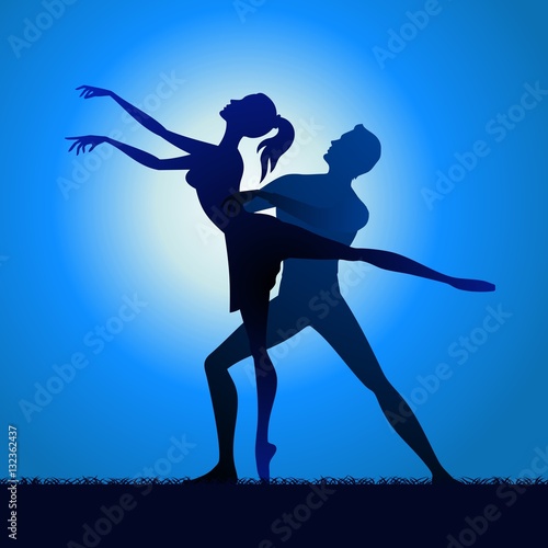 Couple silhouette dancing on grass