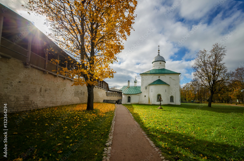 Sunny day in the old fortress. The picture shows a church and fortress wall. Sunny day in the old fortress. The picture shows a church and fortress wall.