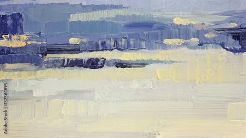 Brushstrokes of blue and yellow oil paint on canvas. Abstract background.
