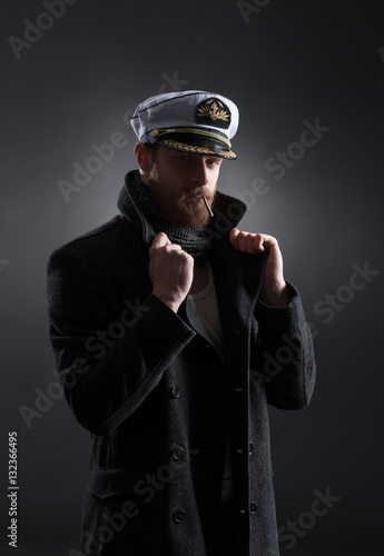 Принти на полотні Portrait of a handsome sailor on a dark background